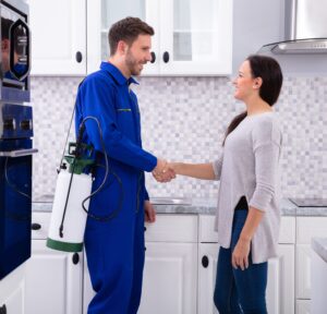 Pest Control Worker Shaking Hands With Woman Pest Control Services Corpus Christi